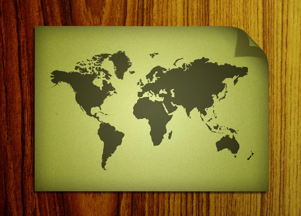 木製の背景に世界地図 — ストック写真