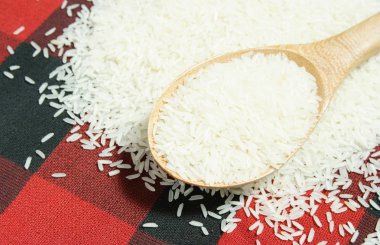 Rice grain and wooden spoon clipart