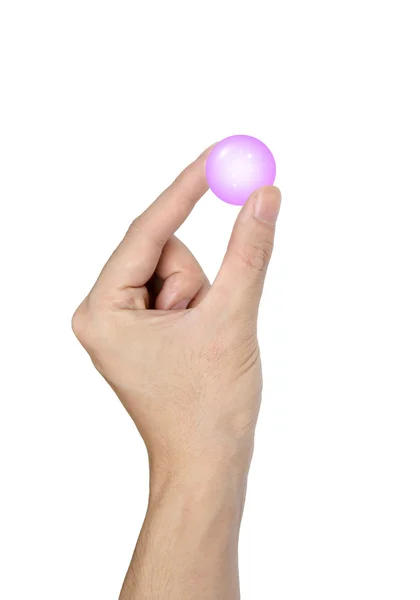 Mão segurando um brilho bola de cristal azul isolado no fundo branco — Fotografia de Stock