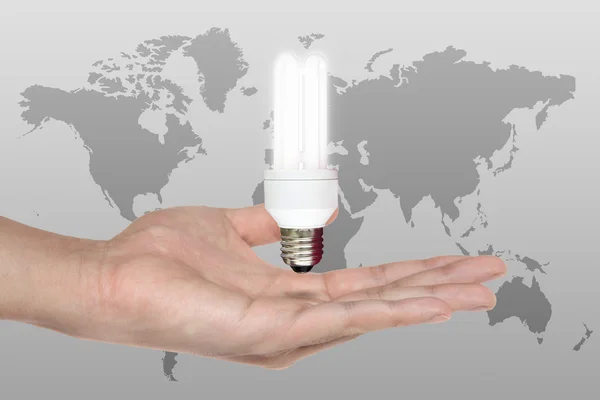 Man håller lampa i handen - kreativitet-konceptet — Stockfoto