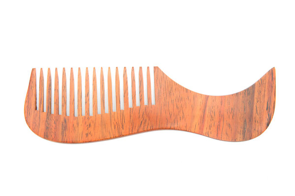 Wooden comb isolated on white background