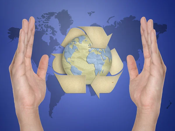 Paper recycling symbol on hand — Stock Photo, Image