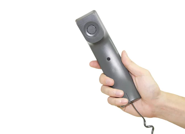 Mão segurando receptor de telefone isolado sobre fundo branco — Fotografia de Stock