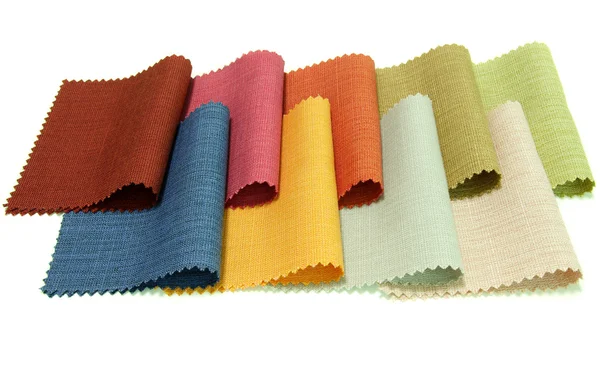 Tom multicolorido de amostra de tecido no fundo branco — Fotografia de Stock