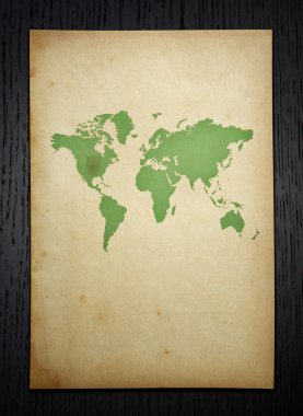 Vintage dünya haritası üzerinde kırpma yolu ile koyu ahşap arka plan