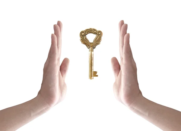 stock image The key to success (hand holding key isolated on white)