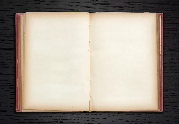 Eski kitap açık koyu ahşap zemin üzerinde — Stok fotoğraf