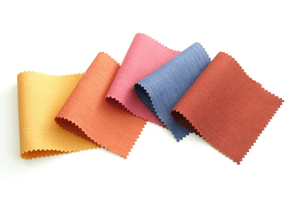 Tom multicolorido de amostra de tecido no fundo branco — Fotografia de Stock