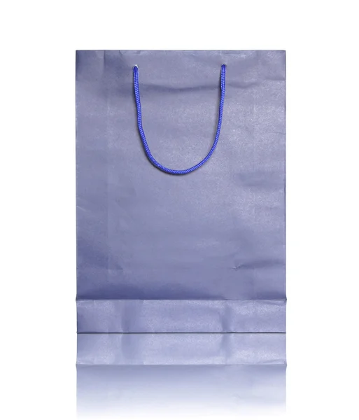 Modré nákupní tašku na odrážejí podlahy a bílé pozadí — Stock fotografie