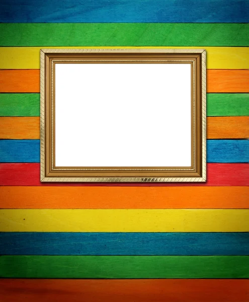 Gold frame on colorful wood Background — Stock Photo, Image