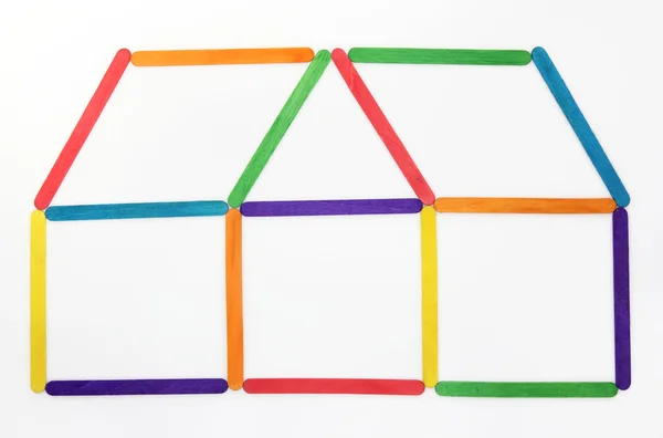 Icono de la casa hecho de madera colorida helado palo — Foto de Stock