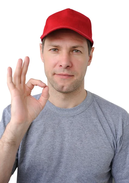 Feeling good working man in a red cap — Stock Photo, Image