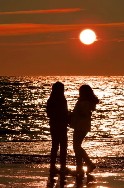 stock image Two girls at sunset