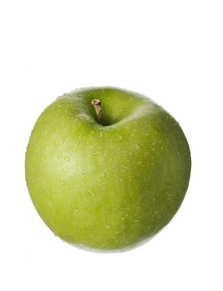 Fruta isolada sobre branco, uma maçã verde com gotas — Fotografia de Stock