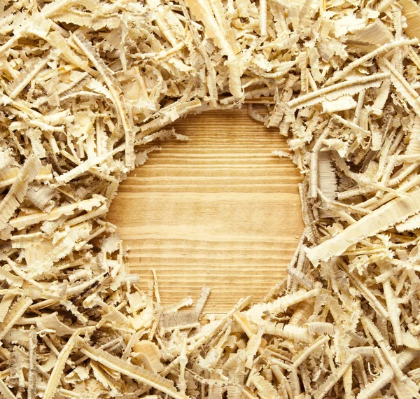 Wooden sawdust and shavings background with space for text — Stock Photo, Image