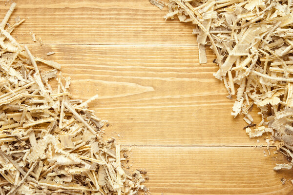 Wooden sawdust and shavings background with space for text