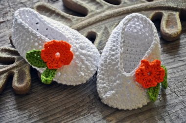 White crochet baby shoes clipart