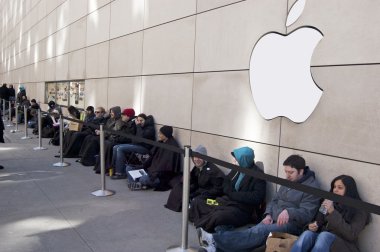 People Waiting in Line for the iPad 2 Release in Downtown Chicago, Illinois USA Outside of the Michigan Avenue Store clipart