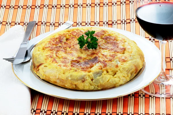 Omelet with potatoes and onion — Stock Photo, Image