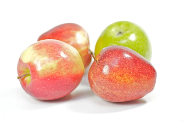 Four delicious apples on white background — Stock Photo, Image