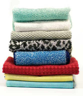 Colorful terry cloth towels isolated on white background clipart