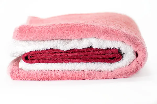 White, red and pink Terry towels isolated on white background — Stock Photo, Image