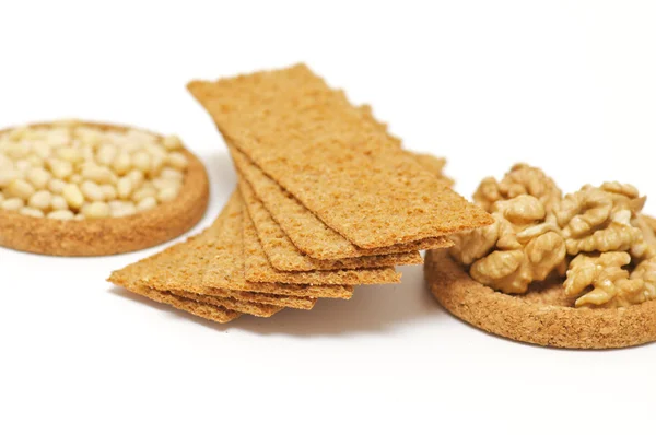 Wholegrains Crispbread with peanut and pine nut isolated — Stock Photo, Image