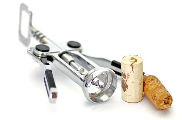 Corkscrew and two wine corks isolated on white background — Stock Photo, Image