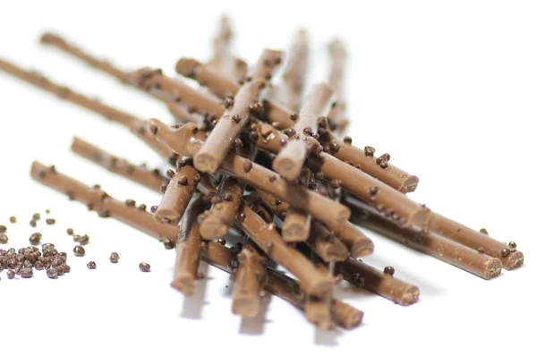 Chocolate sticks with chocolate granules isolated on white background — Stock Photo, Image