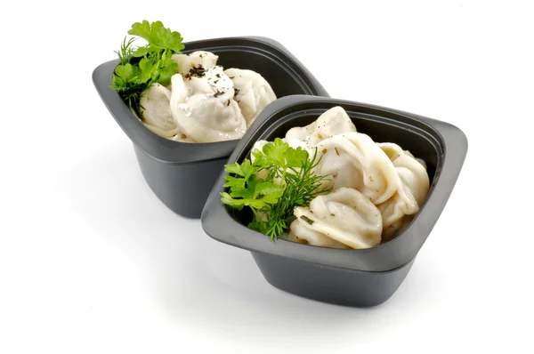 stock image Meat pelmeni with sour cream and greens