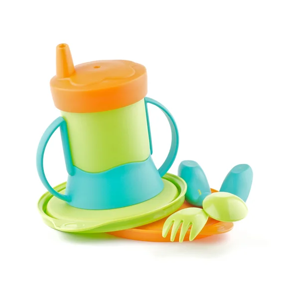 Více barevné kojeneckých lahví a dětské nádobí — Stock fotografie