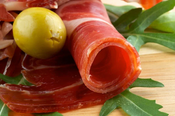 Slices of jamon and olives — Stock Photo, Image