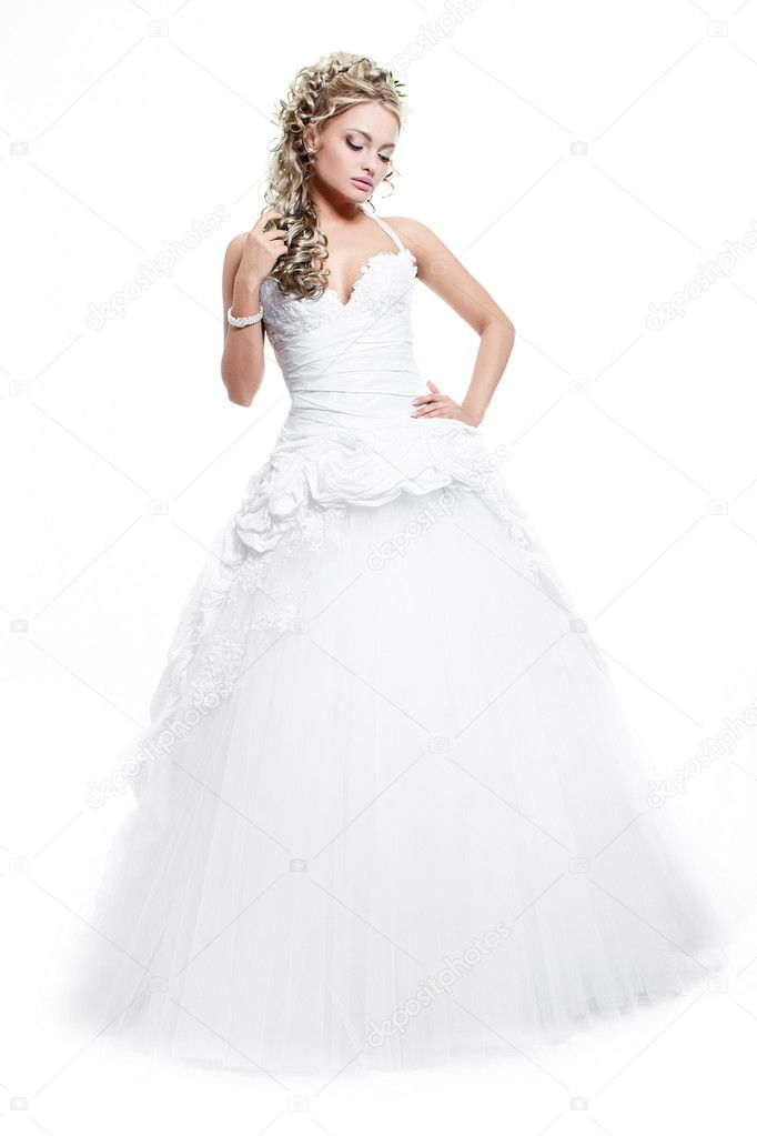 Happy smiling beautiful bride blond girl in white wedding dress with hairstyle and bright makeup on white background full length