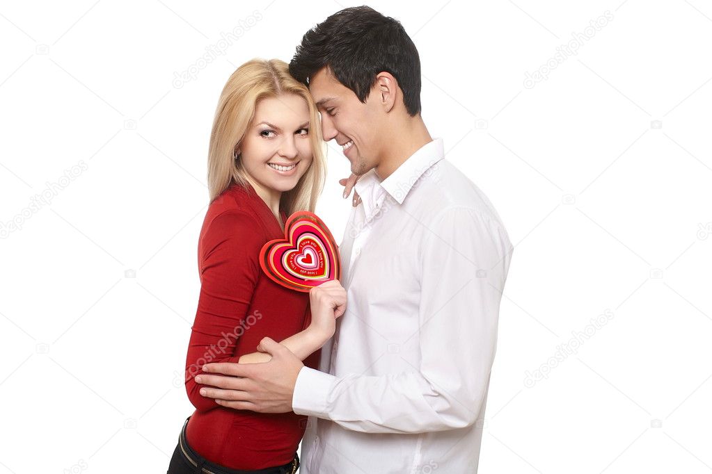 Young romantic handsome man presenting st valentine's card to his gir