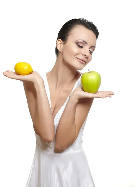 Beautiful happy smiling girl with fruits lemon and green apple — Stock Photo, Image