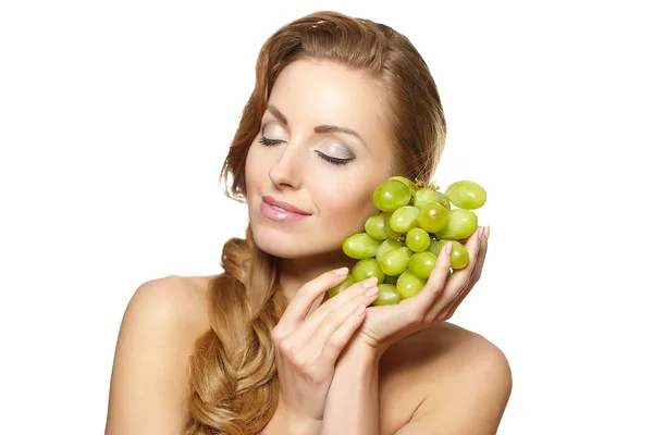 Smiling beautiful woman holding a bunch of grape — Stock Photo, Image