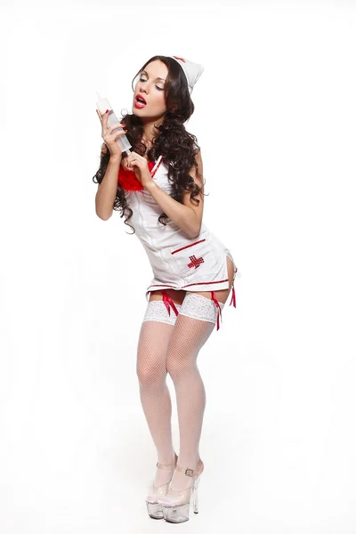 Sexy hermosa mujer morena médico con jeringa grande rojo lencería blanco s —  Fotos de Stock