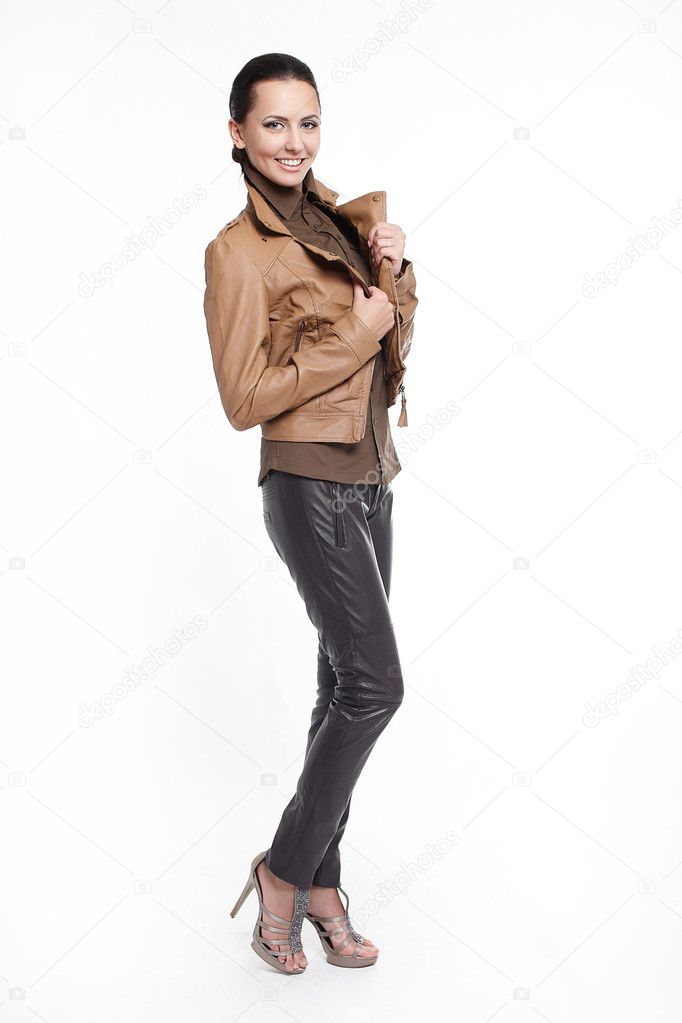 Young beautiful sexy smiling stylish woman in brown jacket isolated on whit