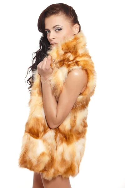 Young pretty beautiful sexy nude brunette girl in fur coat bright makeup long curly hair isolated on white — Stock Photo, Image