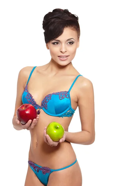 Portrait of beautiful smiling brunette woman in white lingerie with green and red apple diet isolated on white — Zdjęcie stockowe