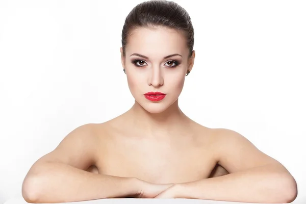 Portrait of sexy serious sitting caucasian young woman model with glamour red lips,bright makeup, eye arrow makeup, purity complexion. Perfect clean skin — Stock Photo, Image