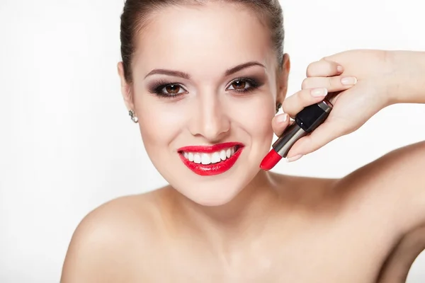 Closeup portrait of sexy smiling caucasian young woman model with glamour red lips,bright makeup, eye arrow makeup, purity complexion with red lipstick. Perfect clean skin.white teeth — Stock Photo, Image