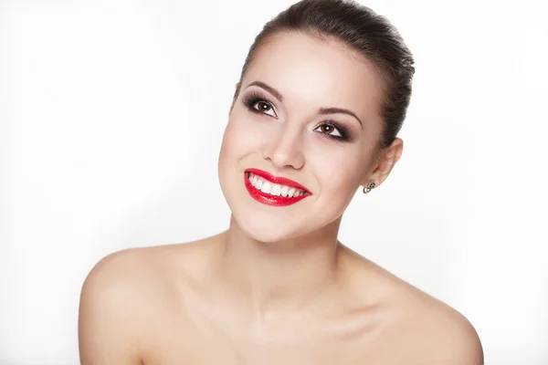 Closeup portrait of sexy smiling caucasian young woman model with glamour red lips,bright makeup, eye arrow makeup, purity complexion. Perfect clean skin.white teeth — Stock Photo, Image