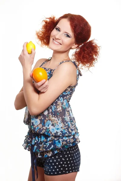Portrait of beautiful smiling redhead ginger woman in summer dress isolated on white with orange and lemon — Stock Photo, Image
