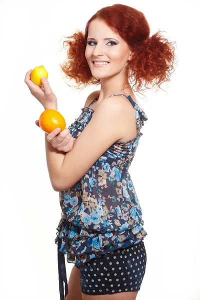 Portrait of beautiful smiling redhead ginger woman in summer dress isolated on white with orange and lemon — Stock Photo, Image