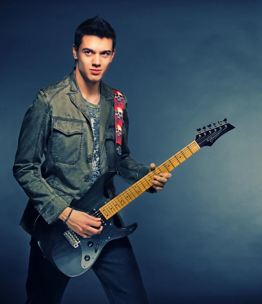 stock image The man with electro guitar