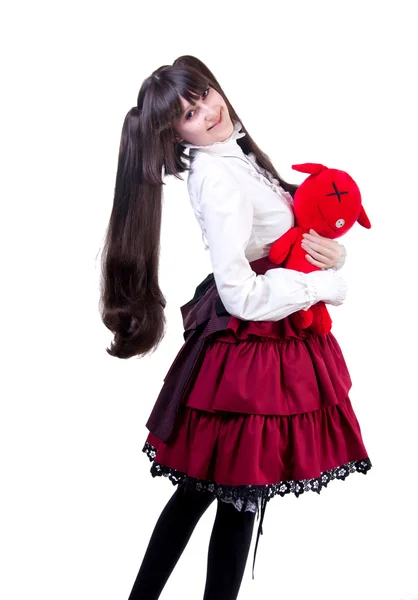 一个红色的玩具的年轻女人 — 图库照片