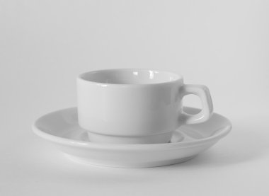 A white coffee cup and saucer