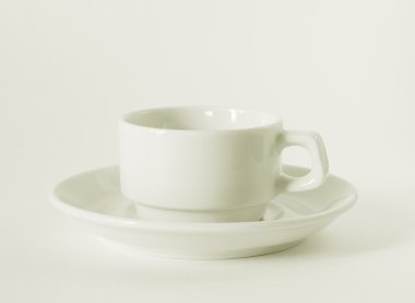 A white coffee cup and saucer