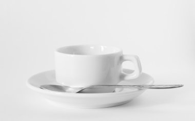 A white coffee cup and saucer